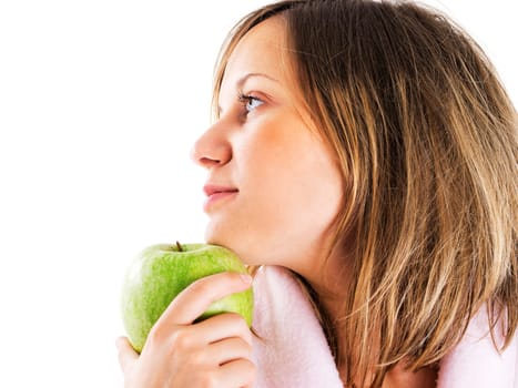 Woman in housecoat with apple