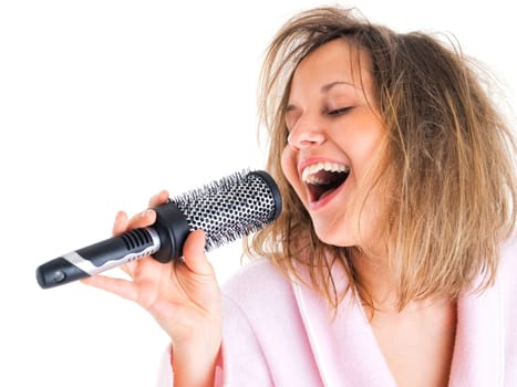Woman singing with hairbrush