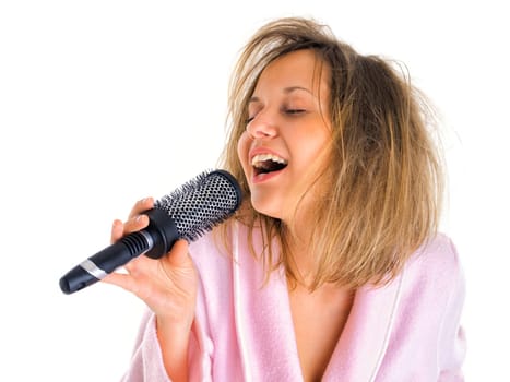 Woman singing with hairbrush