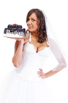 Young bride eating cake isolated on white background