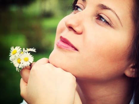 Woman with camomiles