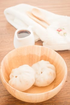 Steamed dumpling stuff on wooden bowl, stock photo