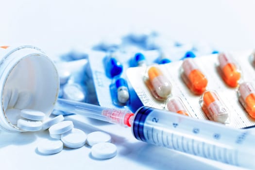 Syringe with glass vials and medications pills drug