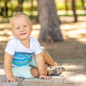 Baby sitting on the path