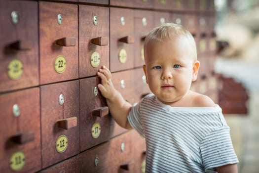 Baby stays near safety boxes