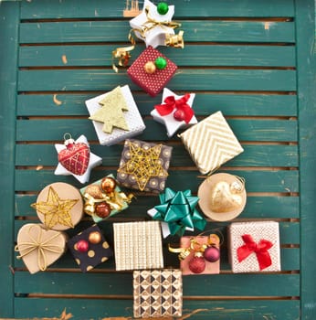 Small colorful gifts for Christmas in Christmas tree shape