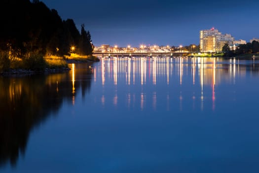 Downtown Umeå, Sweden at Night overlooking the river.