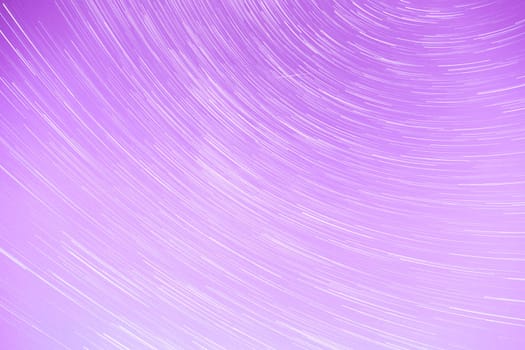 Star Trails streaking across a Purple Sky.