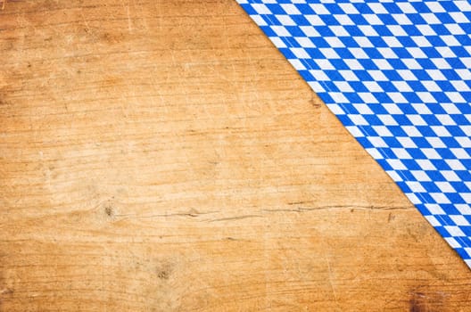 Wooden background with a Bavarian tablecloth