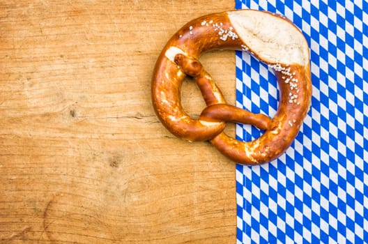 Pretzel with a Bavarian tablecloth