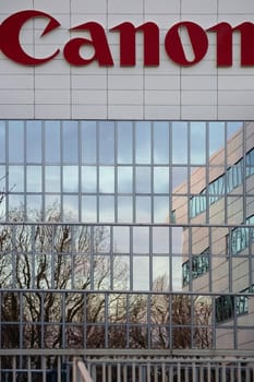 Amsterdam,Netherlands – December 30,2014: The canon logo on a modern cladding of a commercial building on December 30,2014 in Amsterdam.