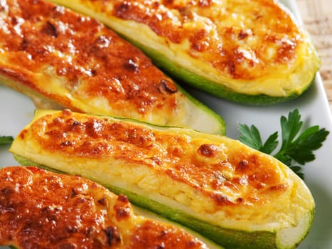 Stuffed zucchini with cheese, baked with mozzarella