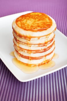 Typical american pancakes with honey