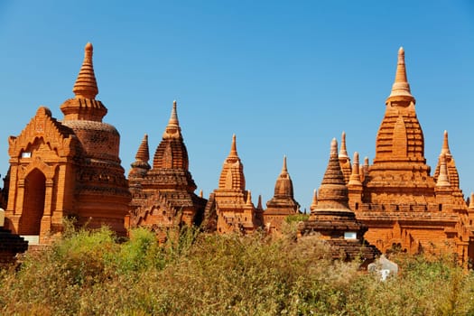 Ancient pagodas in Bagan, blue sky in background