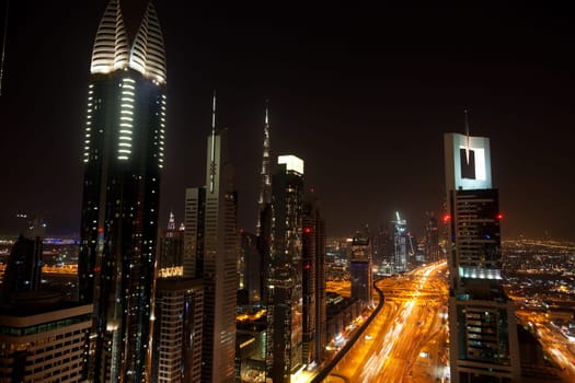 View of Dubai skyline at night from 42th floor terrace of Four Points Sheraton Hotel at Sheikh Zayed Road