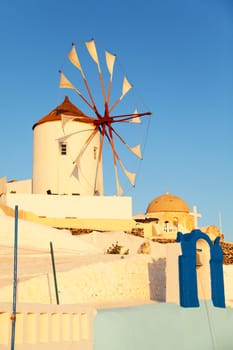 Windmill in Oia, Santorini during a sunny summer day