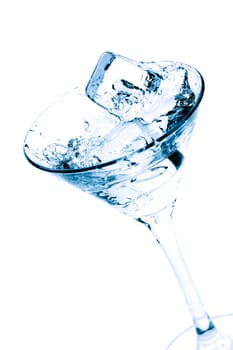 Martini splash with ice cubes
