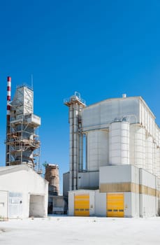 Old cement plant. Preheating tower and storage silos