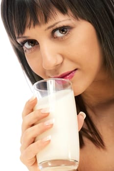 Woman drinking milk looking at camera, isolated on white background with copy space