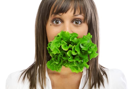 Young woman eating fresh salad isolated on white