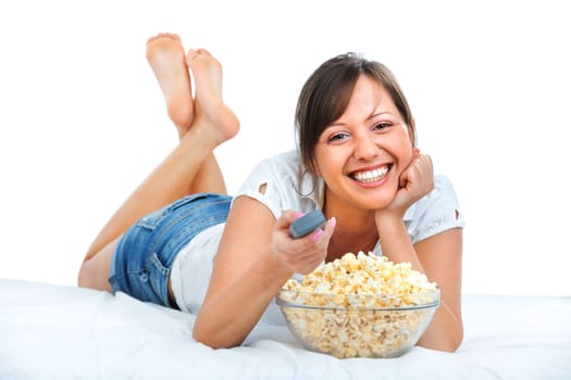 Young woman eating popcorn isolated on white background