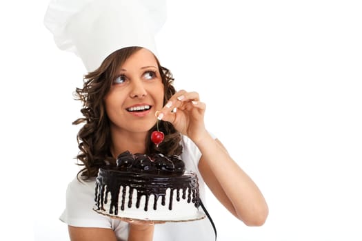 Young chef woman holding chocolate cake, isolated on white