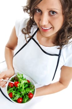 Youg woman eating healthy salad isolated on white background
