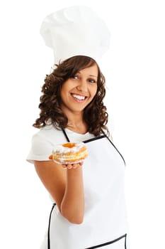 Young woman as chef eating donut, close up