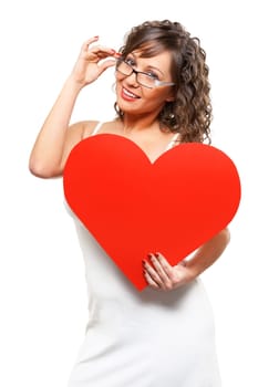 Young attractive woman holding red paper heart like a valentine card