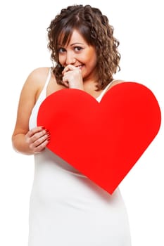 Young attractive woman holding red paper heart like a valentine card
