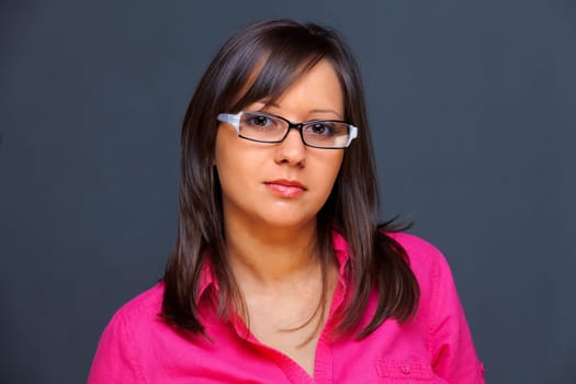 Woman with eyeglasses isolated on black