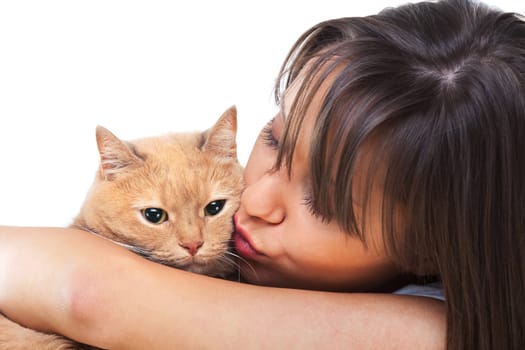 Young woman posing at camera with redhaired domestic cat