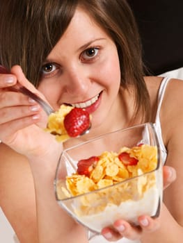 Woman in bed heaving breakfast