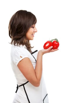 Young woman holding fresh tomatos in hands