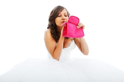 Young bride preparing her make up isolated on white background