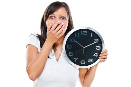 Young woman posing at camera with clock in her hands