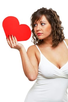 Young attractive woman holding red paper heart like a valentine card
