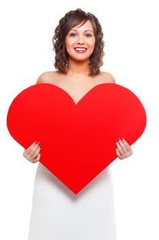 Young attractive woman holding red paper heart like a valentine card