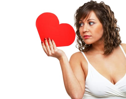 Young attractive woman holding red paper heart like a valentine card