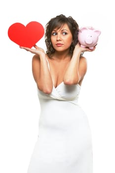 Young attractive woman holding red paper heart like a valentine card and pink piggy bank