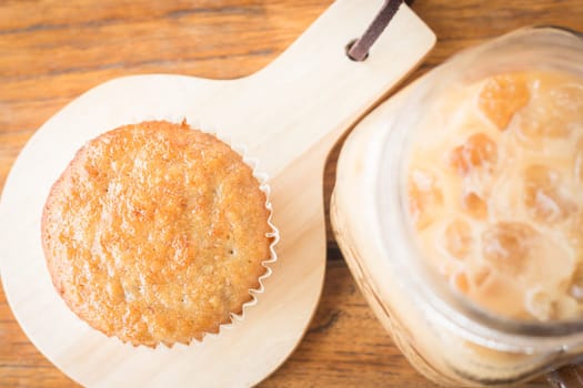 Banana cupcake and iced coffee, stock photo