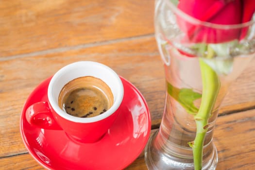 Hot espresso serving on wooden table, stock photo