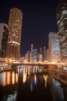 Night falls on the buildings and architecture of Chicago, Illinois