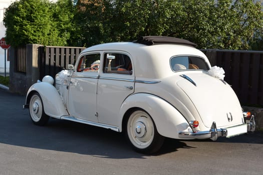 Wedding car on the side of the road in a village in Slovenia