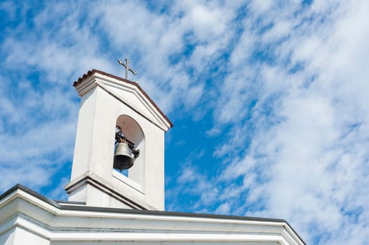Small bell tower with a bell of a country church i