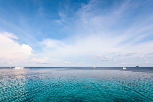 Background blue sky and cloud in summer over Andaman Sea at Honeymoon Bay in Mu Koh Similan island National Park, Phang Nga Province, Thailand
