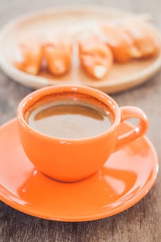 Hot coffee on wooden table, stock photo