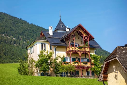 traditional house in the center of St. Wolfgang, Austria - mountain in the background