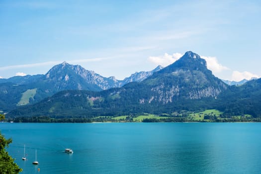 view over the lake Wolfgangsee, Austria, turquoise blue water, mountains in the background