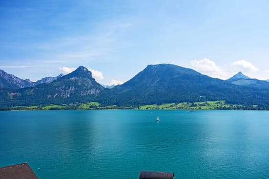 view over the lake Wolfgangsee, Austria, turquoise blue water, mountains in the background
